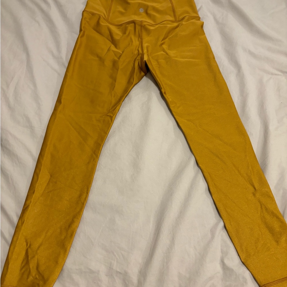 Athleta Elation Shine Tight in Gold Size M